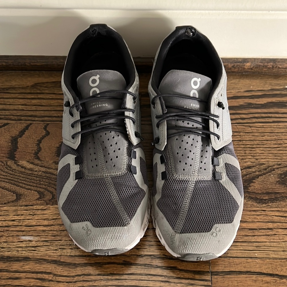 On gray sneakers